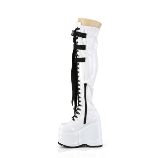 Product image of Demonia WAVE-315 Wht Stretch Patent 6 Inch Wedge PF Lace-Up Stretch Thigh Boot Side Zip