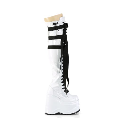 Product image of Demonia WAVE-315 Wht Stretch Patent 6 Inch Wedge PF Lace-Up Stretch Thigh Boot Side Zip